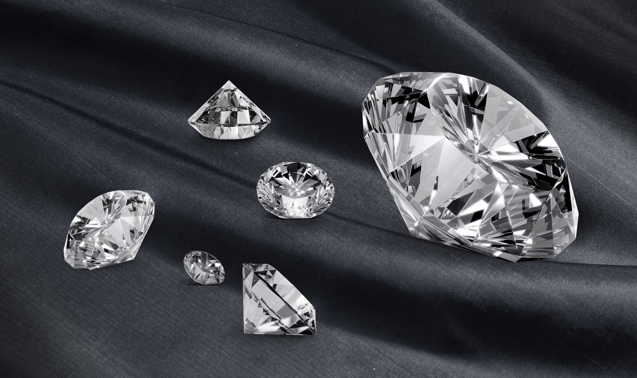 Polished diamonds on black fabric